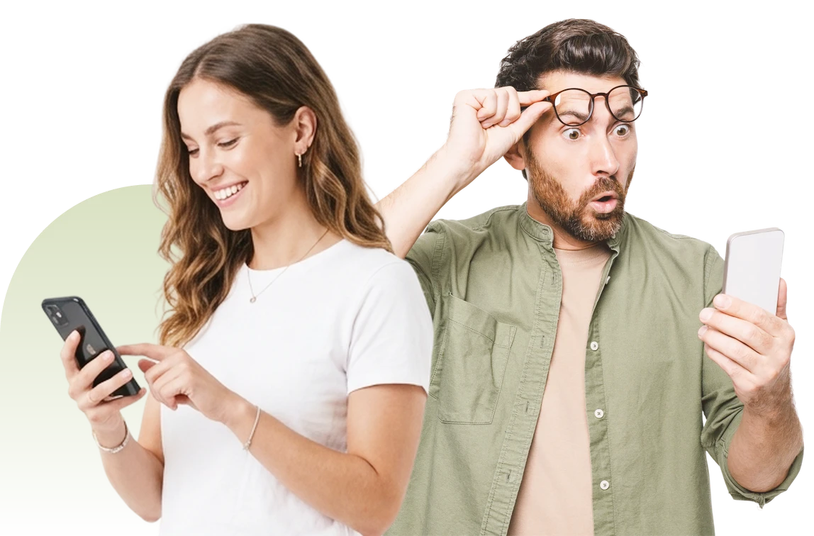 Smiling woman and surprised man looking at their phones